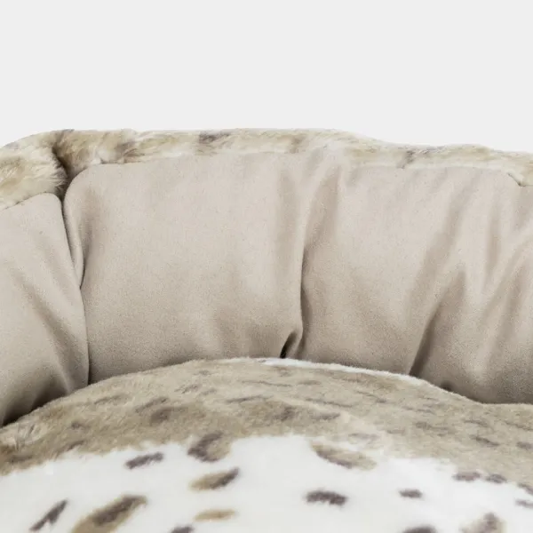 Cama nido para perros con bordes acolchados y estampado de leopardo, ideal para el descanso y confort de tu mascota