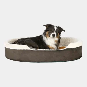 Cama de Invierno Acolchada para Perro – Confort en cada descanso Perro de raza pastor australiano tumbado en una cama de invierno para perro de color gris oscuro con borde de sherpa blanco, indicando comodidad y calidez