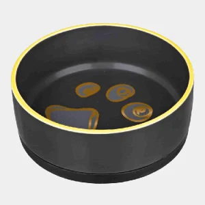 Elegante comedero de cerámica negro con detalles en amarillo y diseño de huellas, ideal para perros y gatos, que aporta un toque de modernidad al espacio de alimentación de tu mascota