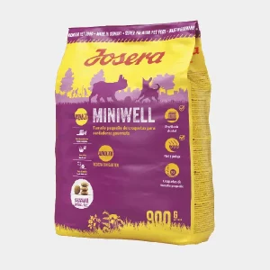 Bolsa de 900g de Josera Miniwell para perros pequeños, mostrando croquetas de tamaño mini para gourmets caninos, libre de gluten y con beneficios para la salud dental y pelaje