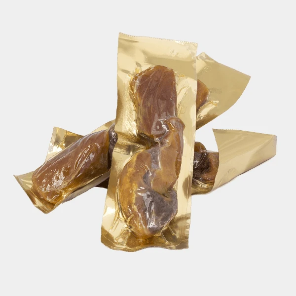 Huesos antisarro para perros envueltos individualmente, hechos de jamón serrano de alta calidad, proporcionando limpieza dental y nutrición en un snack delicioso