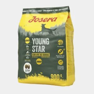 Bolsa de 900g de comida seca para cachorros Josera Young Star, sin cereales y con ave de corral, promoviendo desarrollo óseo y un contenido energético moderado. Packaging amarillo con imagen de un perro joven y un bosque al amanecer