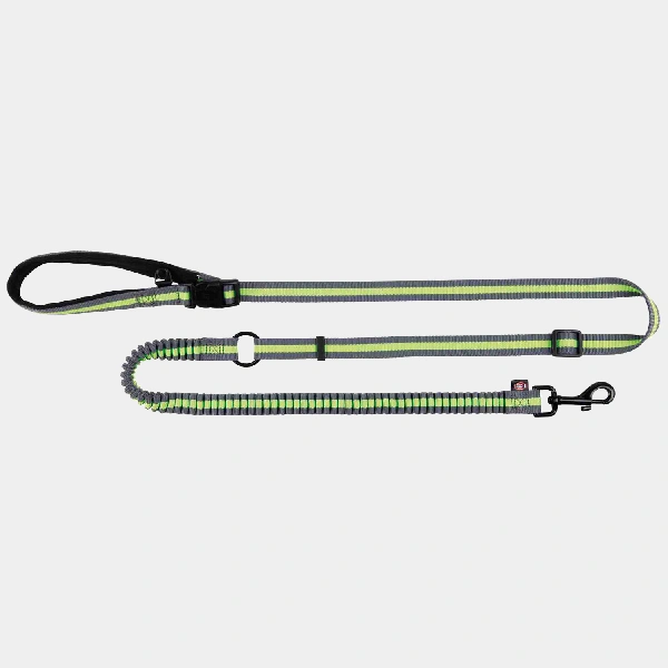 Correa reflectante con cinturón ajustable manos libres Trixie en color verde lima, ideal para paseos y canicross con tu perro
